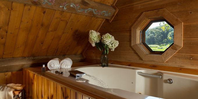 BainUltra Whirlpool in the loft inside the Little House on the Prairie log cabin at Justin Trails Resort.