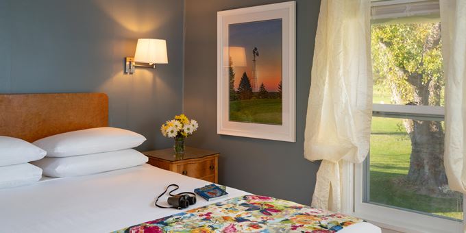 Queen-size bed inside the Queen Suite at Justin Trails Resort.